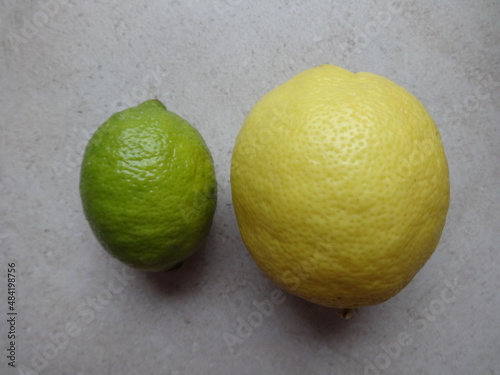 Lime and Lemon on Gray Background