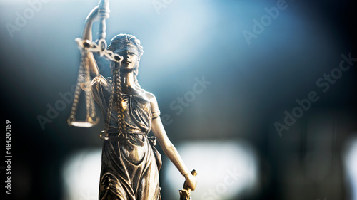 Blindfolded lady justice is holding scales