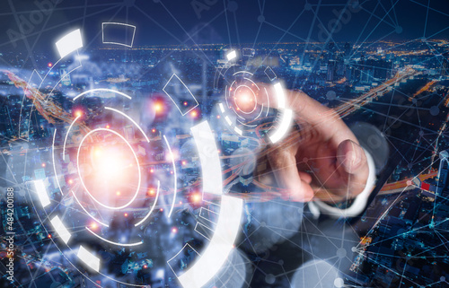 business man touch on digital meta verse icon with link connection network on double exposure of highway transportation over downtown skyline for success technology data network business