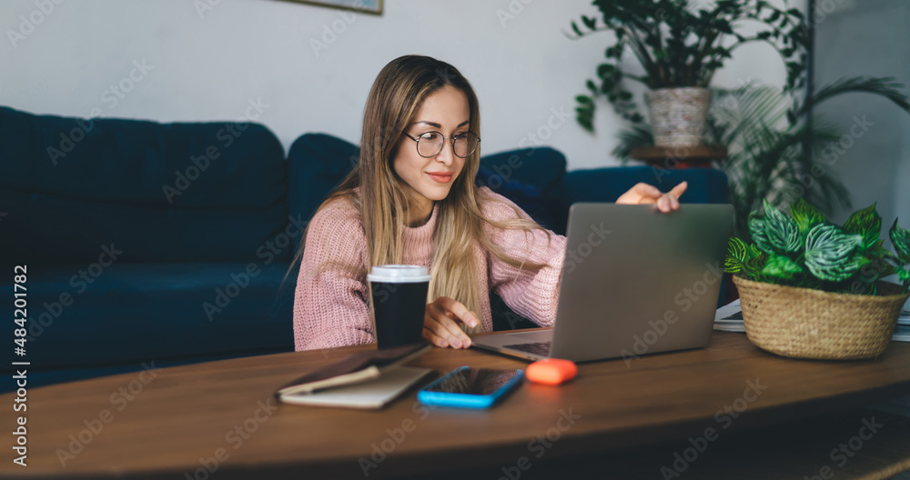 European girl in glasses using laptop at home European girl in glasses using laptop at home