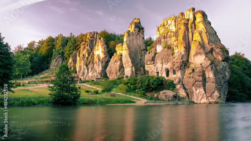 Rock formation at sunrise. With a lake in the foreground. externalstones