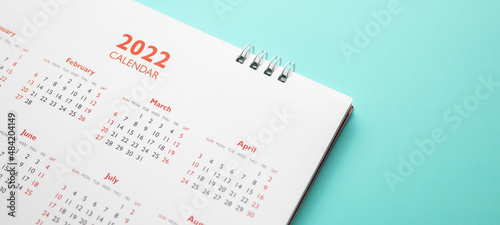 2022 calendar page on blue background business planning appointment meeting concept