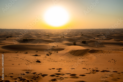 Sunset in the desert dunes of Dubai