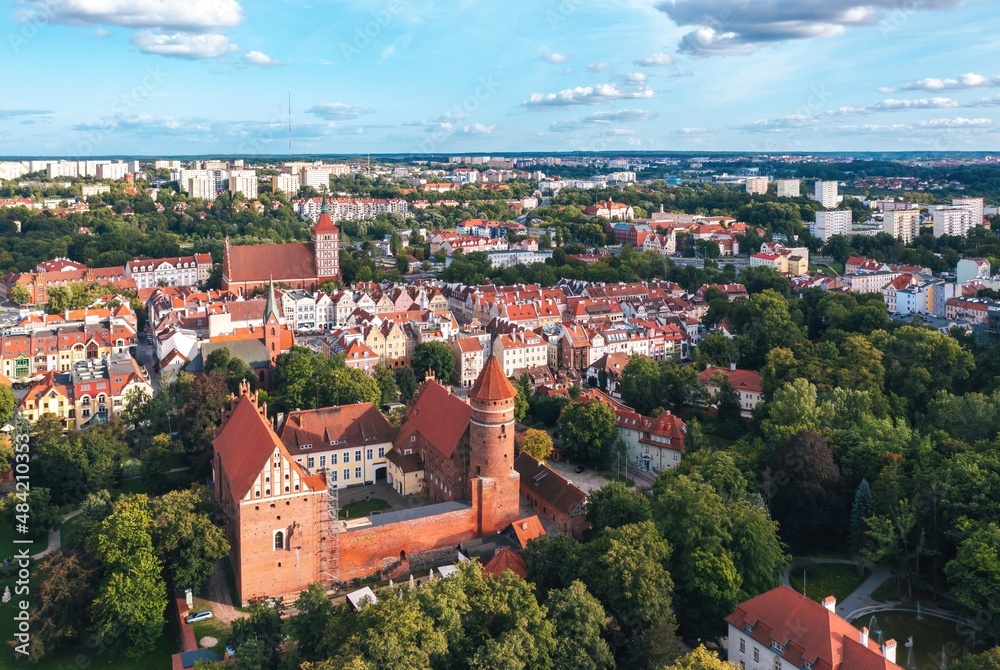 Summer aerial cityscape of Olsztyn (Poland) castle and old town at sunset.