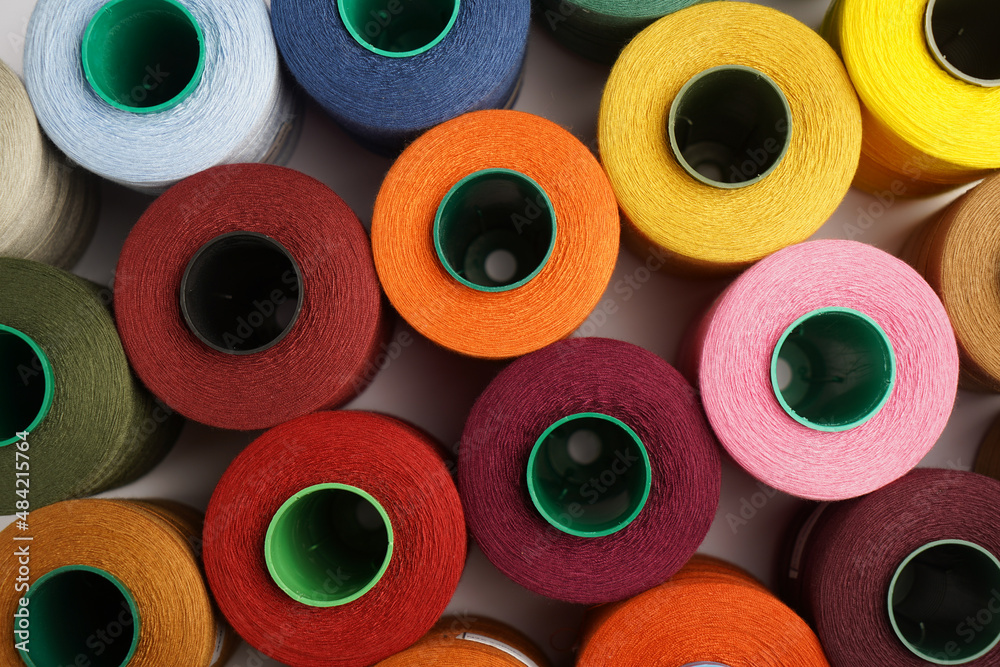 Colorful thread spool background, close-up Colorful thread spool background, close-up