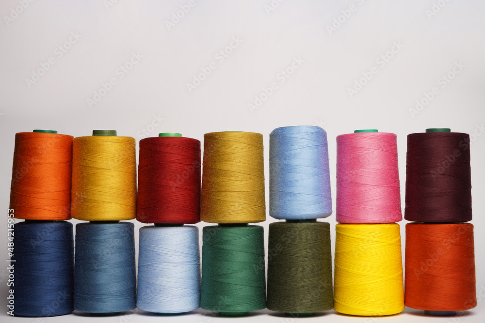 Colorful thread spool background, close-up Colorful thread spool background, close-up