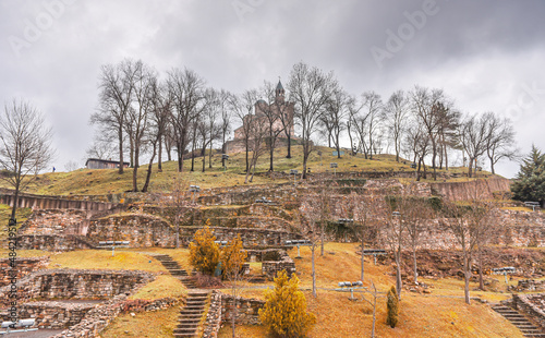 Tsarevets Fortress in Veliko Tarnovo. Top view over the main landmark and the entire city from Bulgaria with its amazing architecture during a cloudy day. photo