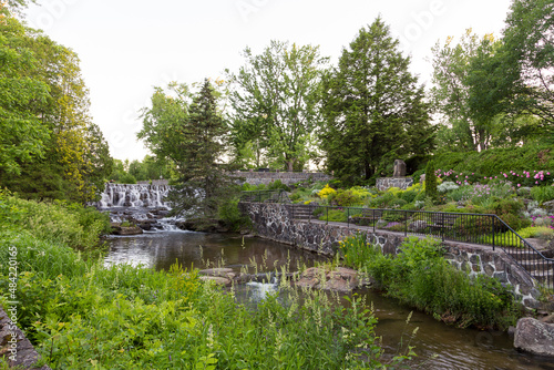 View of the Du Berger River and small waterfall in the Des Moulins Park seen during a spring early morning, Quebec City, Quebec, Canada