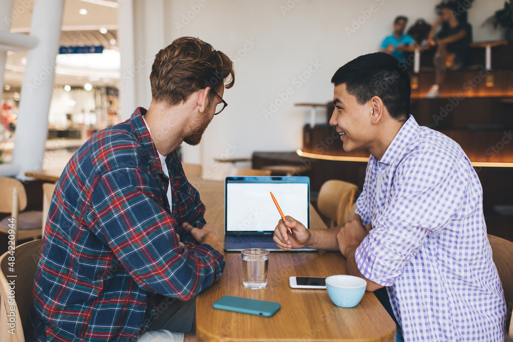 Multiracial business men working in office space Multiracial business men working in office space