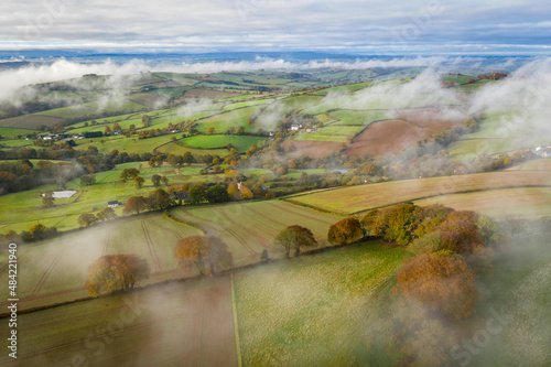 Rolling countryside on a misty autumnal morning near Cadbury, mid Devon, England
