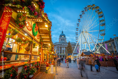View of Christmas market stalls, ferris wheel and Council House on Old Market Square, Nottingham, Nottinghamshire, England photo