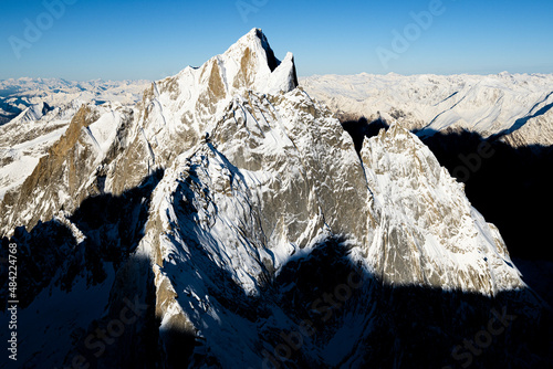 Aerial view of Pizzo Cengalo mountain peak covered with snow, Val Masino, Valtellina, Sondrio province, Lombardy, Italy