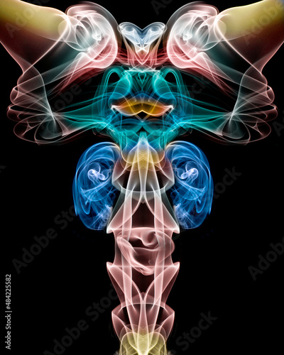 Abstract design made by manipulating and adding color to images of smoke.