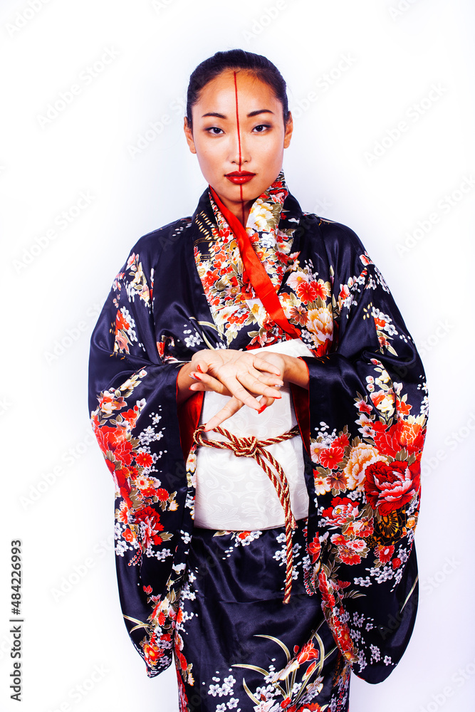 young pretty geisha in black kimono posing isolated on white background, asian ethno young pretty geisha in black kimono posing isolated on white background, asian ethno