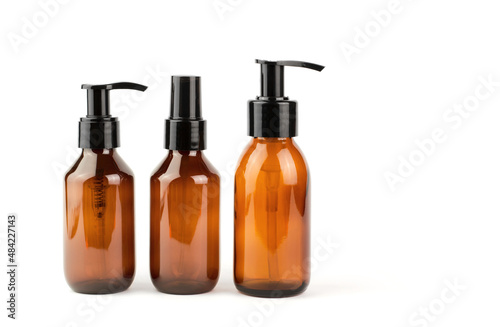 Cosmetic bottles with dispensers on a white background. SPA products