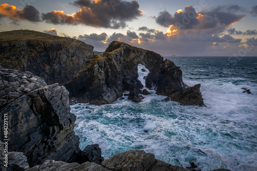 Stac a Phris Natural Sea Arch at sunset, near Shawbost, Isle of Lewis, Outer Hebrides, Scotland photo