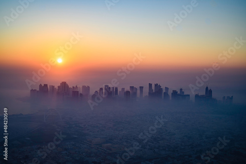 Doha skyline at sunrise with morning fog © Cavan