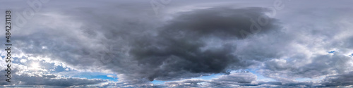 blue sky with dark beautiful clouds before storm in seamless hdri panorama 360 degrees angle view with zenith for use in 3d graphics or game development as sky dome or edit drone shot