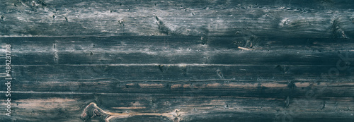 Weathered old wooden vintage barn wood. Timber wood wall texture background. Used as natural background. Vintage toned. Empty template.