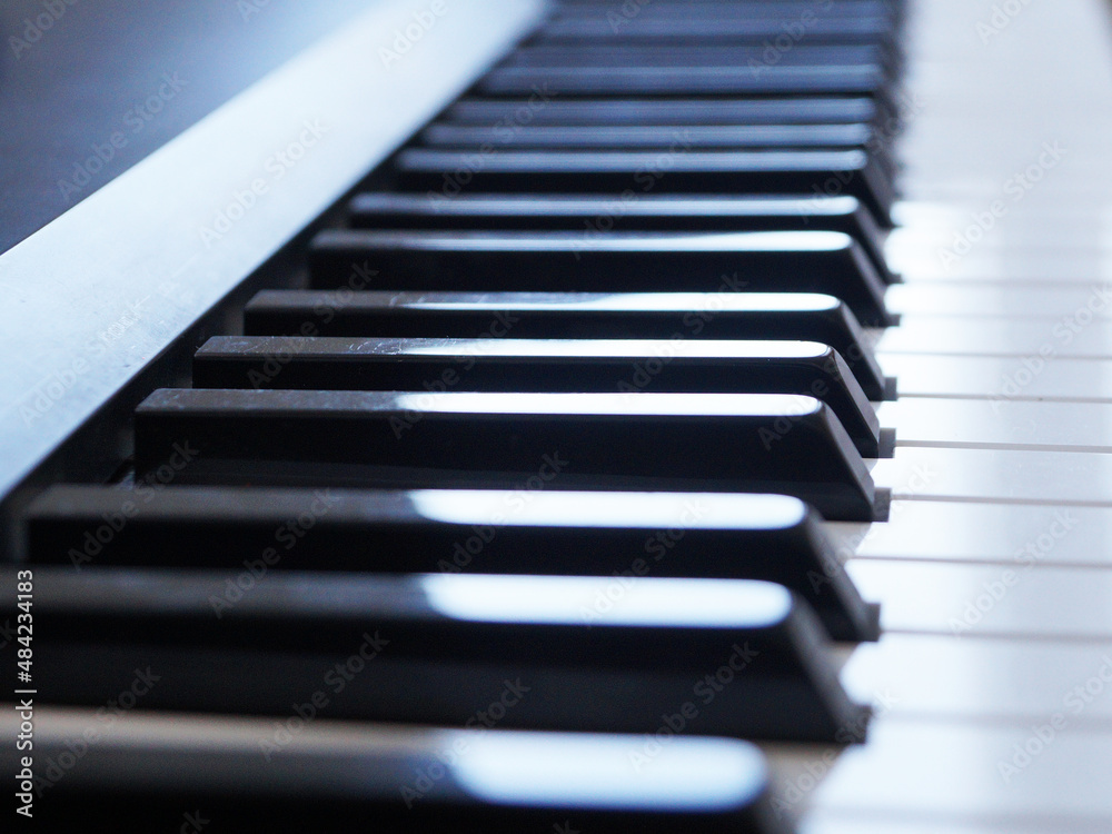 blurred electronic piano keyboard, perspective view for music background blurred electronic piano keyboard, perspective view for music background