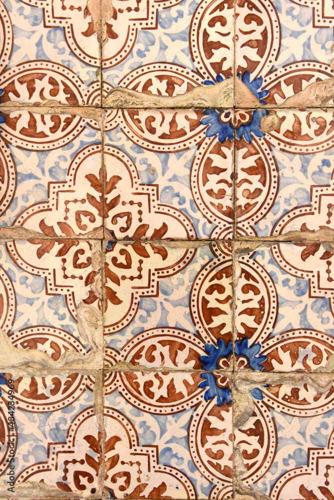 old damaged tiles in Portugal, blue,brown and white, photography takes in buildings of Portugal