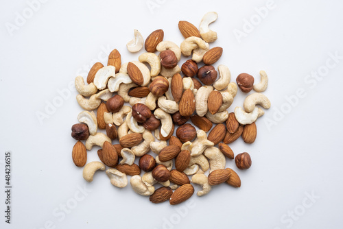 Different nuts on a white background top view close-up.
