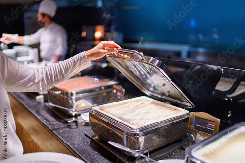 Catering buffet food with heated trays in hotel all inclusive service