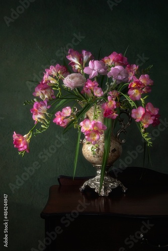 Still life with bouquet of anemones and freesia photo