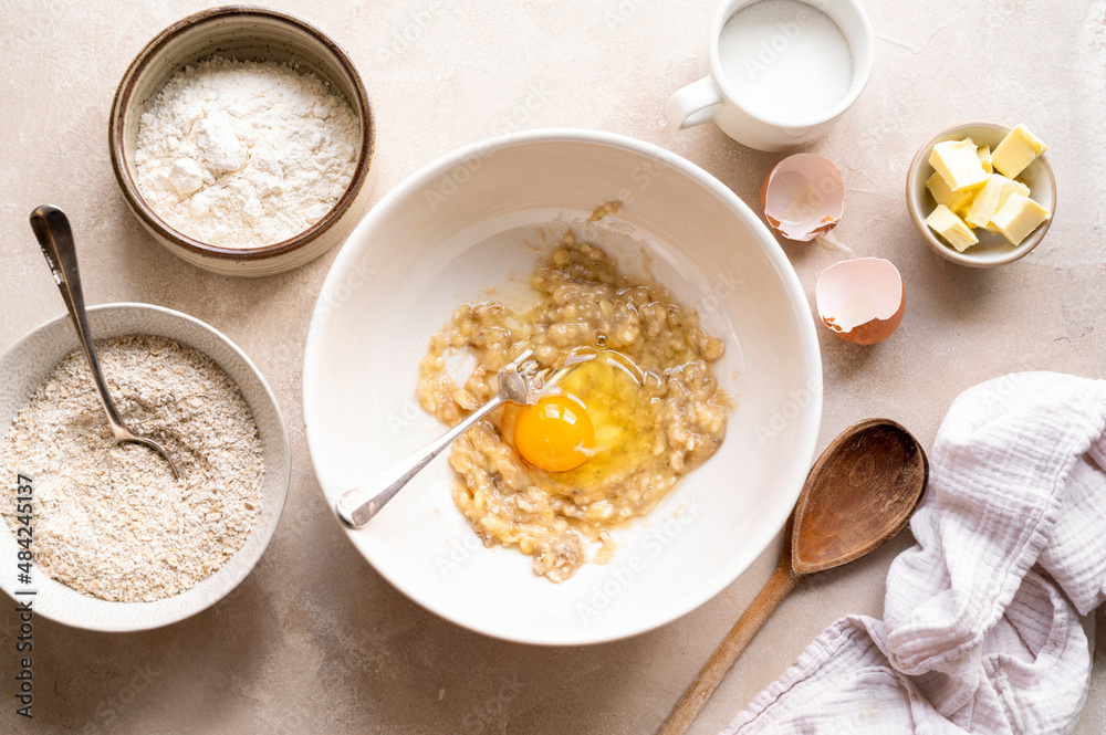 Ingredients for preparing banana cookies and dough on color wooden background Ingredients for preparing banana cookies and dough on color wooden background