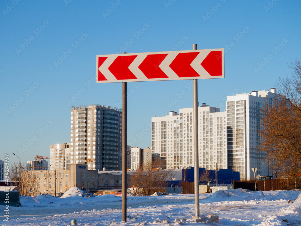 Direction indicator on the background of a high-rise building. Direction indicator on the background of a high-rise building.