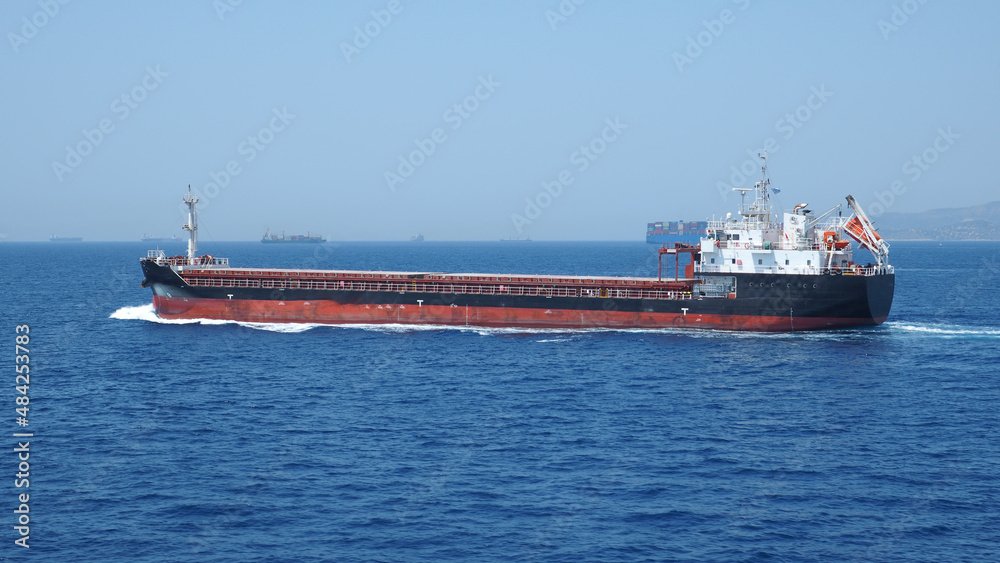 Crude oil tanker carrier cruising in deep blue open ocean sea