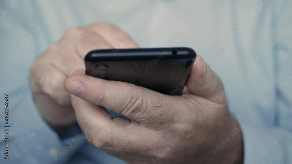 Man Using a Cellphone. Businessman Texting on Mobile Phone. Browsing Internet Pages using a Smartphone. Man Using a Cellphone. Businessman Texting on Mobile Phone. Browsing Internet Pages using a Smartphone.