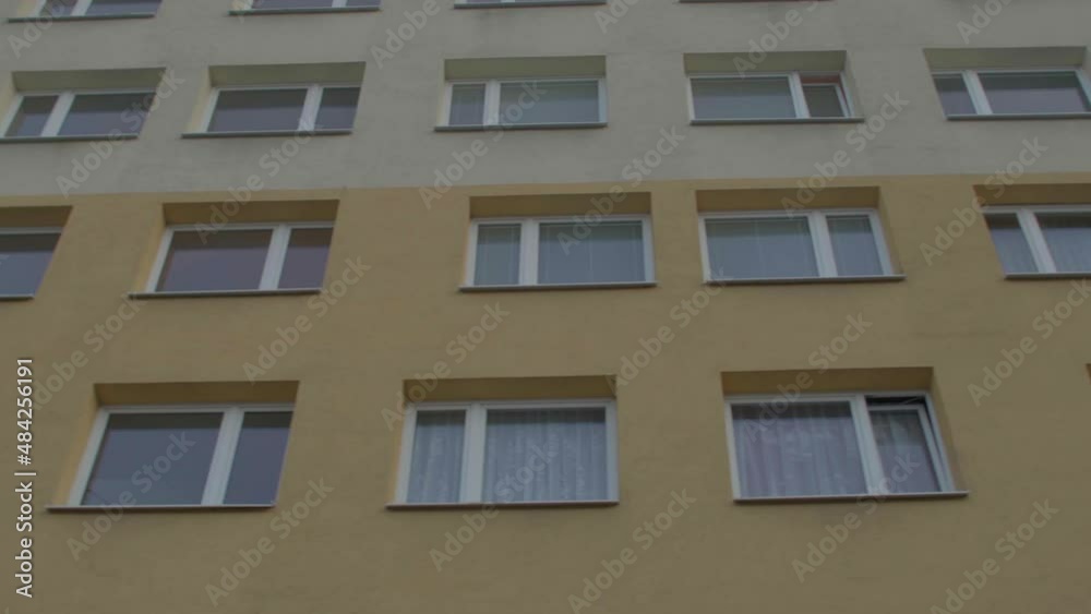Windows of an apartment building. Yellow facade. No city can grow without the space to house its population, and managing the housing of a town. Windows of an apartment building. Yellow facade. No city can grow without the space to house its population, and managing the housing of a town.