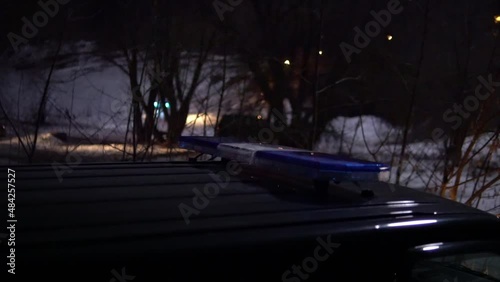 police car flashing lights night winter