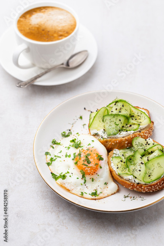 Keto Toasts with ricotta, egg, cucumber and black sesame.