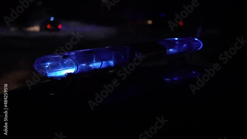 police car flashing lights night winter