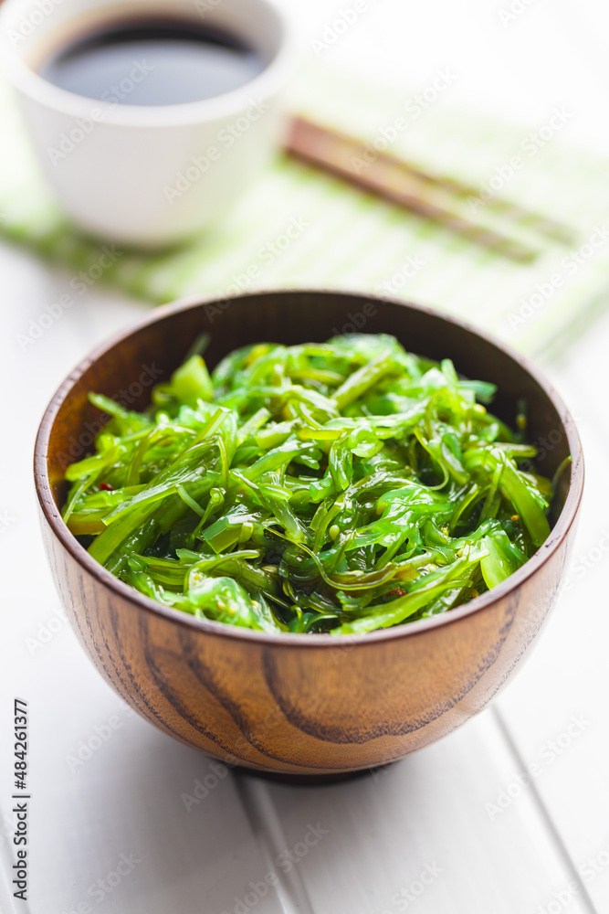 Green wakame. Seaweed salad in bowl Green wakame. Seaweed salad in bowl