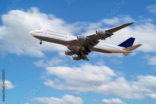 Untitled passenger plane flying at airport. Schedule flight travel. Aviation and aircraft. Air transport. Global international transportation. Airliner with sky background.