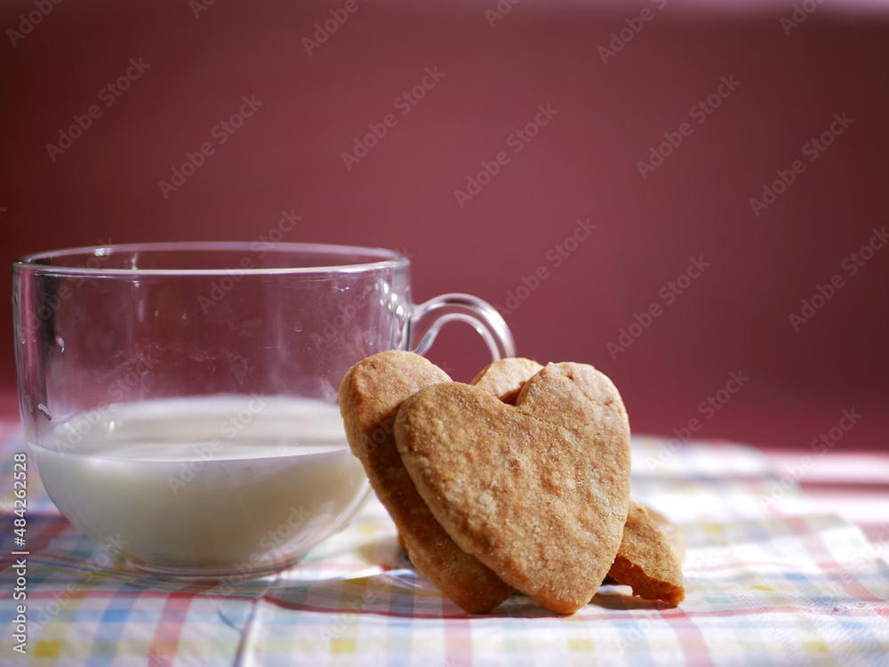 Heart shaped homemade cookies and glass of milk Heart shaped homemade cookies and glass of milk