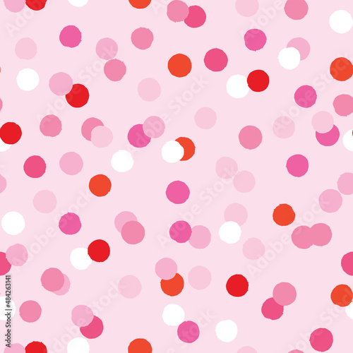Seamless pattern with red and pink confetti. Simple repeat design with dots