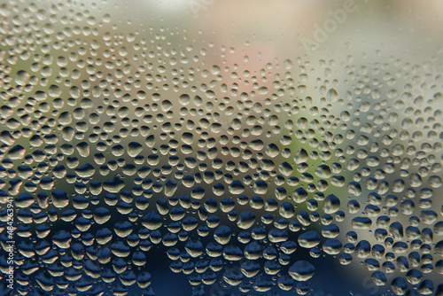 Morning humidity dropped on a window, abstract background