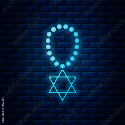 Glowing neon Star of David necklace on chain icon isolated on brick wall background. Jewish religion symbol. Symbol of Israel. Jewellery and accessory. Vector