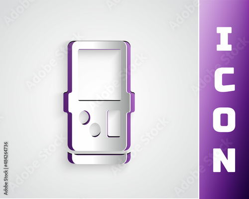 Paper cut Portable tetris electronic game icon isolated on grey background. Vintage style pocket brick game. Interactive playing device. Paper art style. Vector