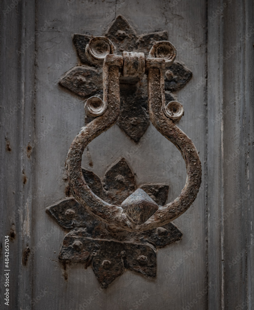 The ancient knocker of a door The ancient knocker of a door