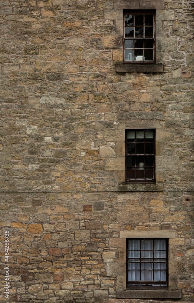 Three Windows on Stone Wall
