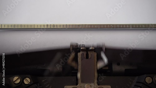 Typing word Pandemic on retro typewriter. Close up. photo