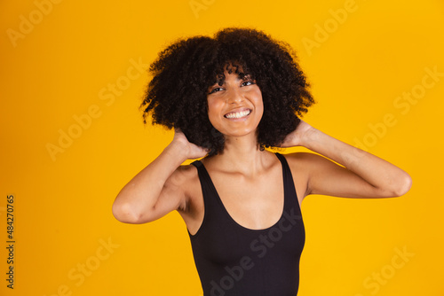 Black girl with big afro. Afro woman with blackpower hair smiling photo