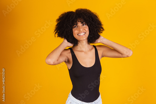 Black girl with big afro. Afro woman with blackpower hair smiling photo