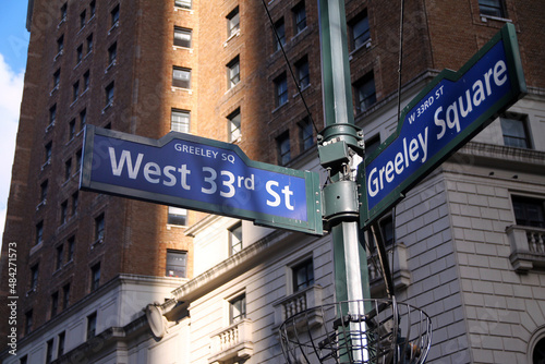 Blue West 33rd Street and Greeley Square on Broadway historic sign