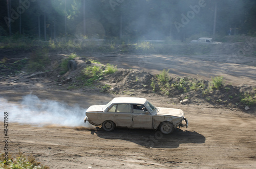 vintage volvo car racing on dusty country road